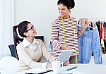 Two Young Businesswomen Working With Digital Tablet In Her Offic Stock Photo