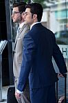 Two Young Executives Arriving At The Hotel Stock Photo