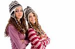 Two Young Friends Wearing Woolen Cap And Looking At Camera Stock Photo