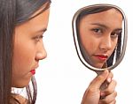 Unhappy Girl Looking At Mirror Stock Photo