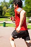 Urban Athlete Doing Sprint In The Park Stock Photo