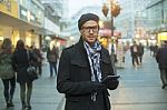 Urban Man Holdin Tablet Computer On Street Stock Photo