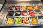 Various Fresh Fruit And Vegetable Salad Bar Healthy Items Stock Photo