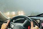 View Through The Cars Windshield  In The Winter Fog On The Road Stock Photo