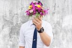 Waiting For His Girlfriend. Close Up Of Handsome Young Man Holdi Stock Photo