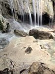 Waterfall With Water Flowing Around Stock Photo