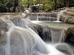 Waterfall With Water Flowing Around Stock Photo