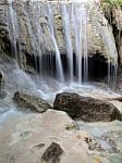 Waterfall With Water Flowing Around Stock Photo