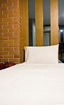 White Bedding Sheet And Pillow Stock Photo