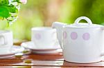 White Porcelain Set For Tea Or Coffee On Wooden Table Stock Photo