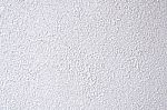 White Rugged Painted Outside Wall Stock Photo