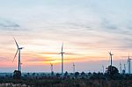 Wind Turbine At Sunrise Stock Photo