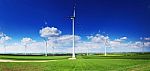 Wind Turbines On Blue Sky Background Stock Photo