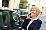 Woman Attending A Business Call Stock Photo