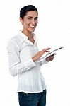 Woman Browsing On New Touch Pad Device Stock Photo