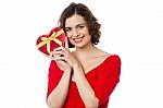 Woman Closely Holding Gift From Her Boyfriend Stock Photo