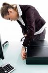 Woman Closing The Briefcase Stock Photo