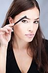 Woman Combing Eyebrow Stock Photo