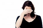 Woman Covering Her Eyes With Hand Stock Photo