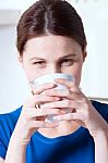 Woman Drinking A Cup Of Tea Stock Photo