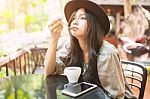 Woman Drinking Coffee In The Garden Outdoor In Sunlight Light En Stock Photo