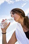 Woman Drinking Water After Sport Activities Stock Photo