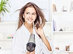 Woman Drying Hair At Home Stock Photo