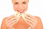 Woman Eating Crackers Stock Photo