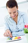 Woman Eating French Cookies At Home Stock Photo