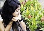 Woman Enjoying Flowers Stock Photo