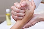 Woman Enjoying Hand Massage At Beauty Spa Stock Photo