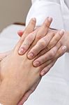 Woman Enjoying Hand Massage At Beauty Spa Stock Photo