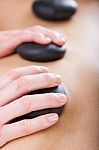 Woman Enjoying Massage At Beauty Spa Stock Photo