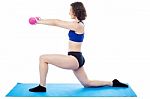 Woman Exercising With Dumbbells, Arms Outstretched Stock Photo