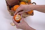 Woman Hands Peeling A Mandarin Stock Photo