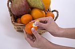 Woman Hands Peeling A Mandarin Stock Photo