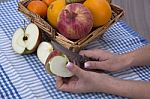 Woman Hands Peeling An Apple With A Knife Stock Photo