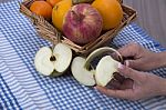 Woman Hands Peeling An Apple With A Knife Stock Photo