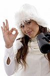 Woman Holding Binocular And Showing Okay Hand Gesture Stock Photo