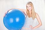 Woman Holding Blue Pilates Ball Stock Photo