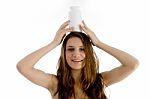 Woman Holding Bottle On Her Head Stock Photo