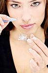 Woman Holding Contact Lens Stock Photo