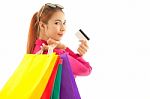 Woman Holding Credit Card And Shopping Bags Stock Photo