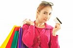 Woman Holding Credit Card And Shopping Bags Stock Photo