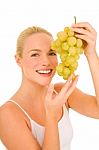 Woman Holding Grapes Stock Photo