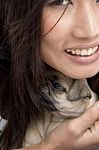 Woman Holding Puppy Stock Photo