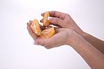 Woman Holding Slices Of Mandarin Stock Photo