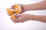 Woman Holding Slices Of Orange Stock Photo