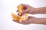 Woman Holding Slices Of Orange Stock Photo