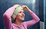 Woman In A Bathroom With A Towel On Her Head Stock Photo